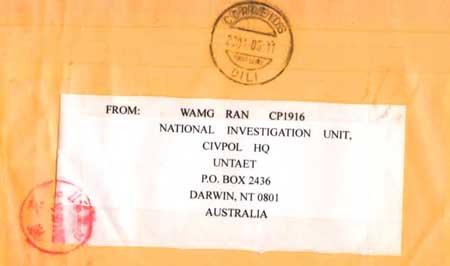 written on a white label on the back of an envelope: " FROM WANG RAN CP1916 NATIONAL INVESTIGATION UNIT, CIVPOL HQ UNTAET P.O.BOX 2436 DARWIN, NT 0801 AUSTRALIA".