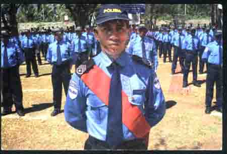 The back is graduation ceremony of Dili Police College in August 2001.